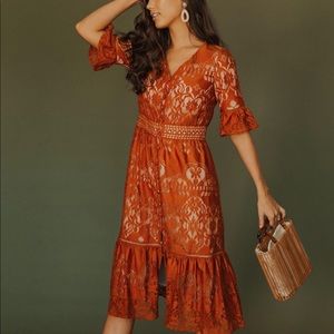 Rust colored, only worn for family pictures. Smoke free home.